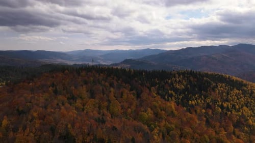 Drone Orbital Shot Over Antenna on Top of the Mountain with Yellowed Autumn Colored Trees Aerial