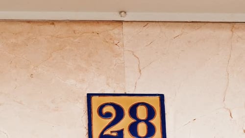 Number 28 (twenty-eight) Affixed to a Building