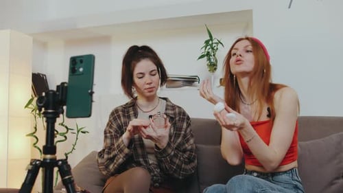 Two Young Women Reviewing Beauty Products