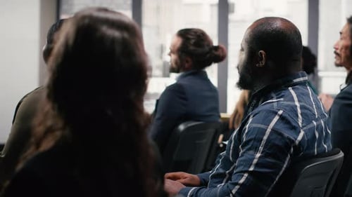 People Seated Attending a Corporate Meeting in an Office