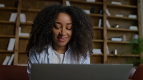 Young Woman Working on Laptop Close Up