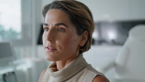 Woman Taking Consultation Cosmetology Procedures Sitting Luxury Cabinet Close Up