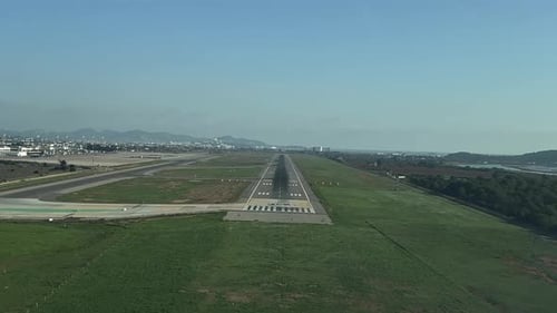 A pilot’s perspective from a jet cockpit of a real time landing at Ibiza’s airport, Spain. Daylight.