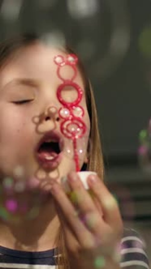 Caucasian Little Girl Blowing Soap Bubbles at Home Party Celebrating Child Kid Daughter Playful Blow