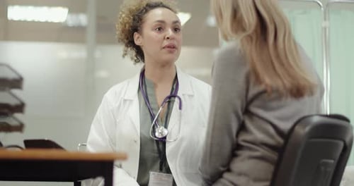 Female Doctor Examining Patient in Doctors Office