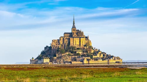 Famous Mont-Saint-Michel at sunset, time lapse.