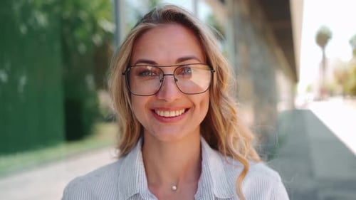 Smiling Young Woman Posing Confidently in City