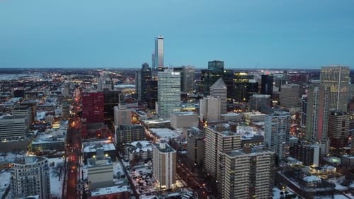2-4 Evening Aerial Fly over post modern lit winter city hardly any traffic from the old town to the