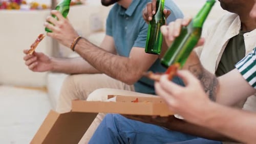 Friends Eating Pizza and Drinking Beer Outside