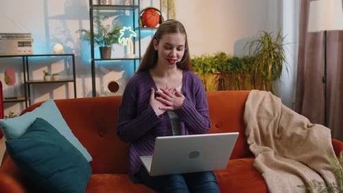 Woman Using Laptop for Video Call From Home