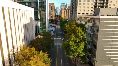 Downtown urban city setting. Aerial flight among highrise buildings in American city. Apartment and