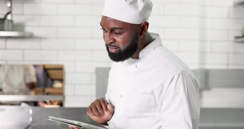 Black man, chef and tablet in restaurant kitchen, smile and scroll with recipe