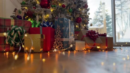 Christmas Presents Under Tree with Fairy Lights