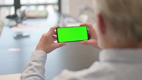 Holding Phone Horizontal with Green Screen