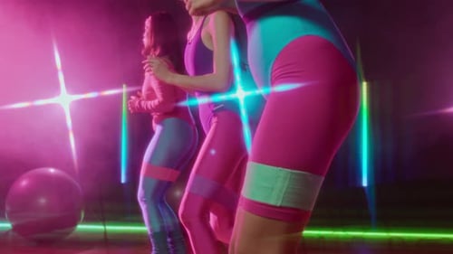 Women Exercise Together in Retro Style Neon Gym