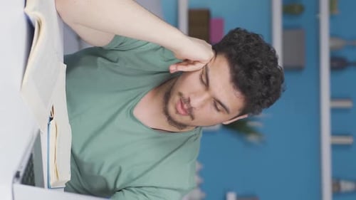 Vertical video of Male student falls asleep while studying.
