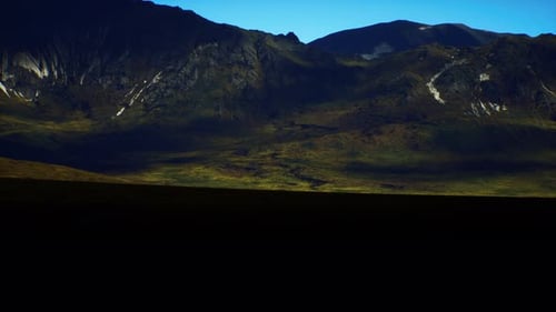 Majestic Mountain Landscape at Dawn Showcasing Vivid Colors and Shadows