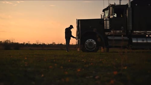 Semi Truck Driver in Front of His Vehicle