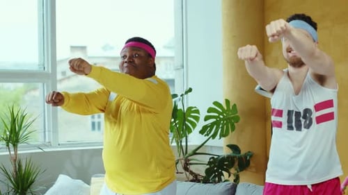 Men in Headbands Doing Retro Calisthenics at Home