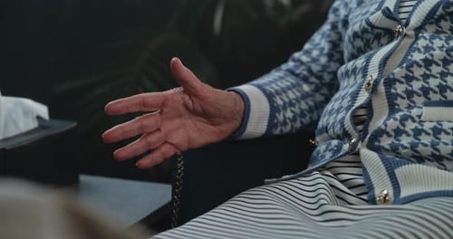 Close Up of Female Patient Gesturing in Psychotherapist's Office