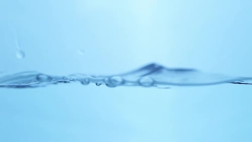 Gentle waves of water ripple across the surface, highlighting the smooth and seamless motion of pure