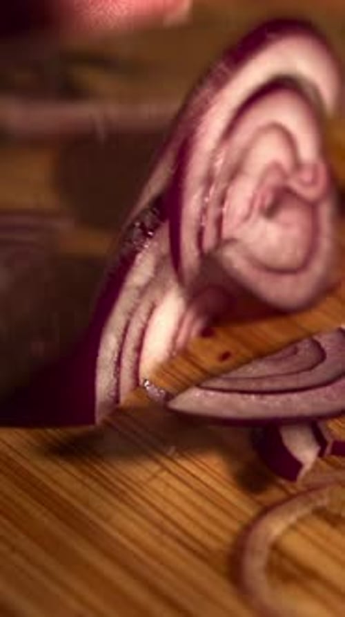 Close Up of Chef Cutting Red Onion