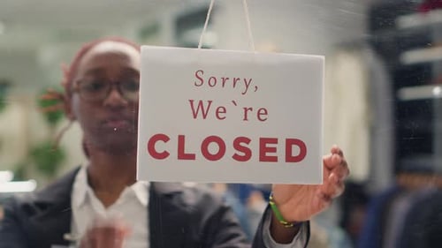 Worker Opening Fashion Boutique