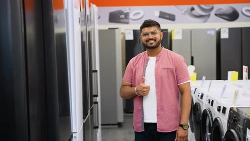 Indian Man Buying a Smart Fridge with Discount in Tech Store