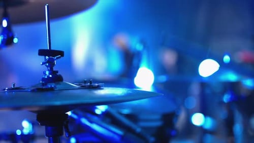 Drummer Plays Kit at Night in Concert