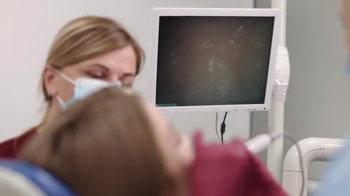 Dentist Attending to Patient in Modern Office