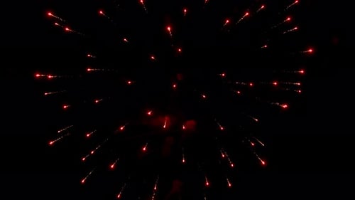 Streaks and flashes of bright colorful night explode and illuminate the black night sky during firew