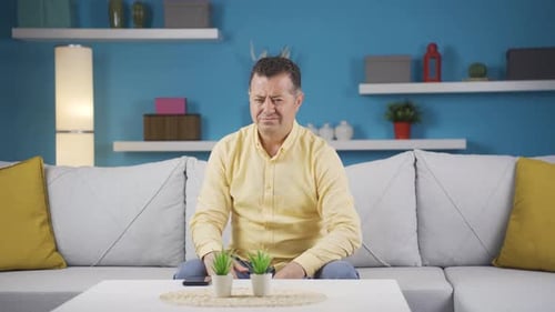 Man looking negative at camera.