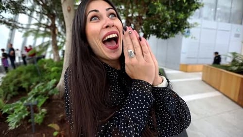Woman Smiling in Indoor Garden Setting