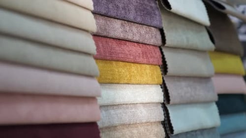 Colorful Fabrics Stacked in a Textile Shop