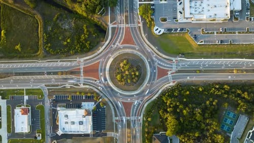 Top View of City Street Traffic on Roundabout Intersection with Fast Moving Cars Timelapse of Urban