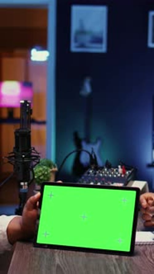 Vertical Video Podcasters Reacting to Amusing Videos on Chroma Key Device