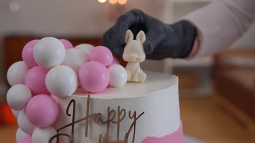Bunny Decoration being Placed on Birthday Cake