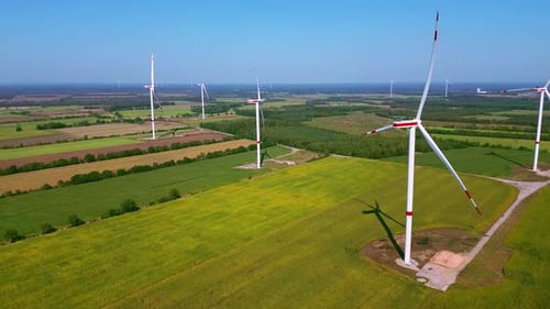 Wind Turbines Turning in Rural Landscape Aerial View