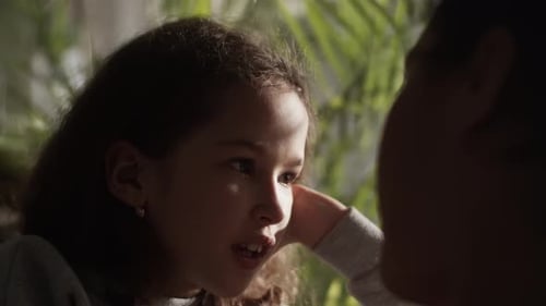 Girl Talking to Someone Indoors