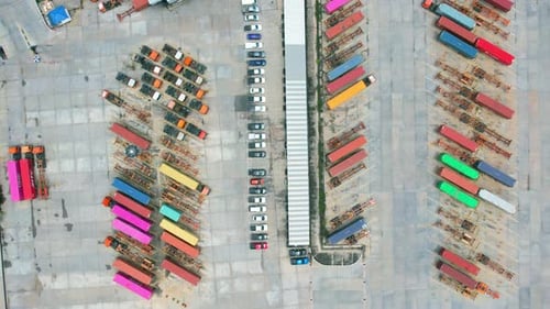 Many of Semi-trailer trucks stand at the distribution center