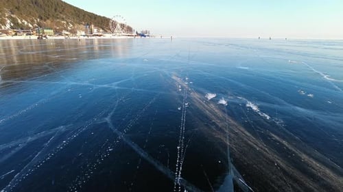 Wind Blows Snow Over Ice of Baikal