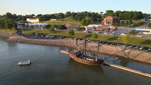 Historic Sailing Ship Docked in Quaint Town