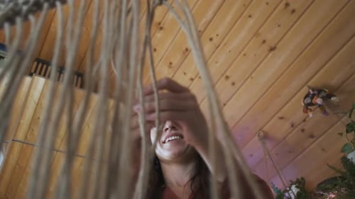bottom view portrait woman weaving macrame