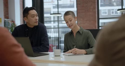 Business People Meeting and Discussing in Office