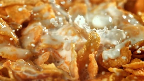 Milk Being Poured on Delicious Corn Flakes