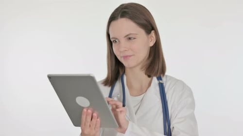 Female Doctor Using Tablet in Hospital Setting