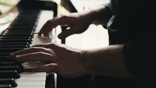 Close Up Of Hands Playing Piano