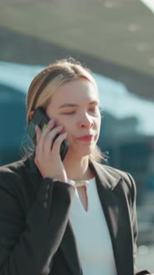 Professional Woman Talking on Phone Outside Office Building