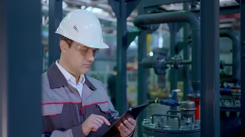 Engineer Man Worker Tablet Heavy Industry Plant Construction Factory Oil Gas Pipeline Manufacture