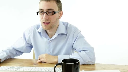 Man Working on Computer Giving Thumbs Up